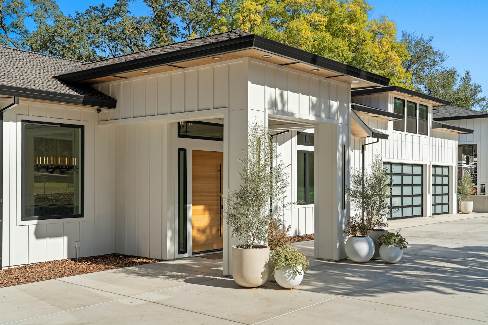 Home exterior with white board-and-batten siding and black trim